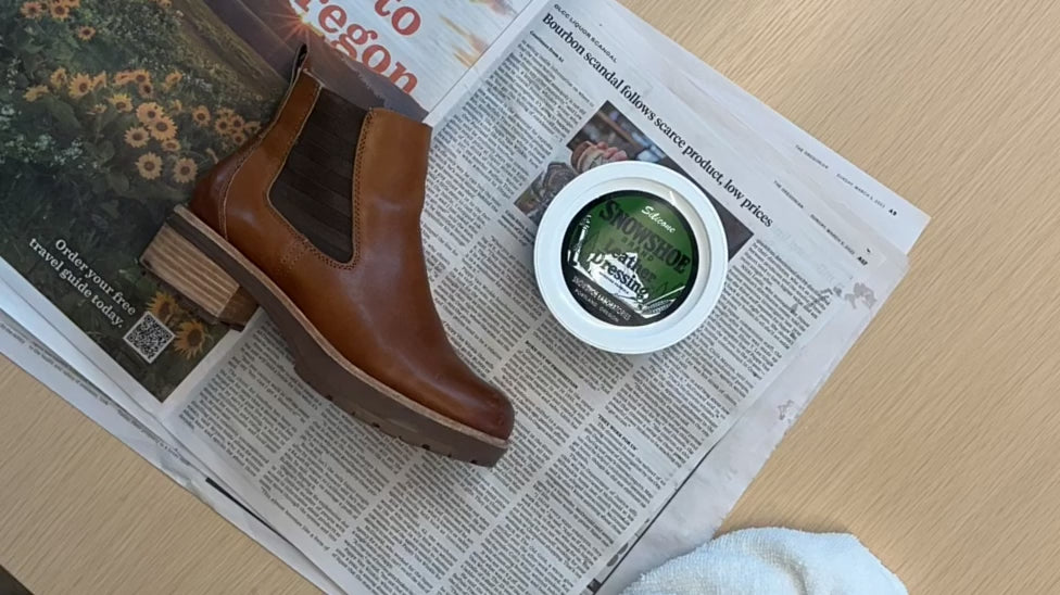 A time lapse video shows the application of Snowshoe Brand Leather Conditioner to a single brown boot.