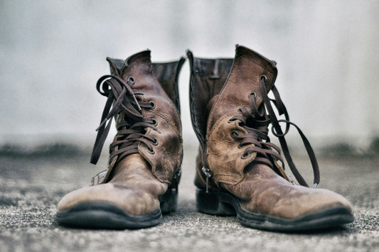 A photo of old leather boots is shown to demonstrate why you should condition your leather.